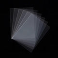 Set of transparent penny sleeves for tcg card games